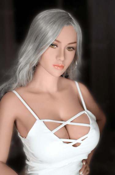a woman in a white dress posing for a picture